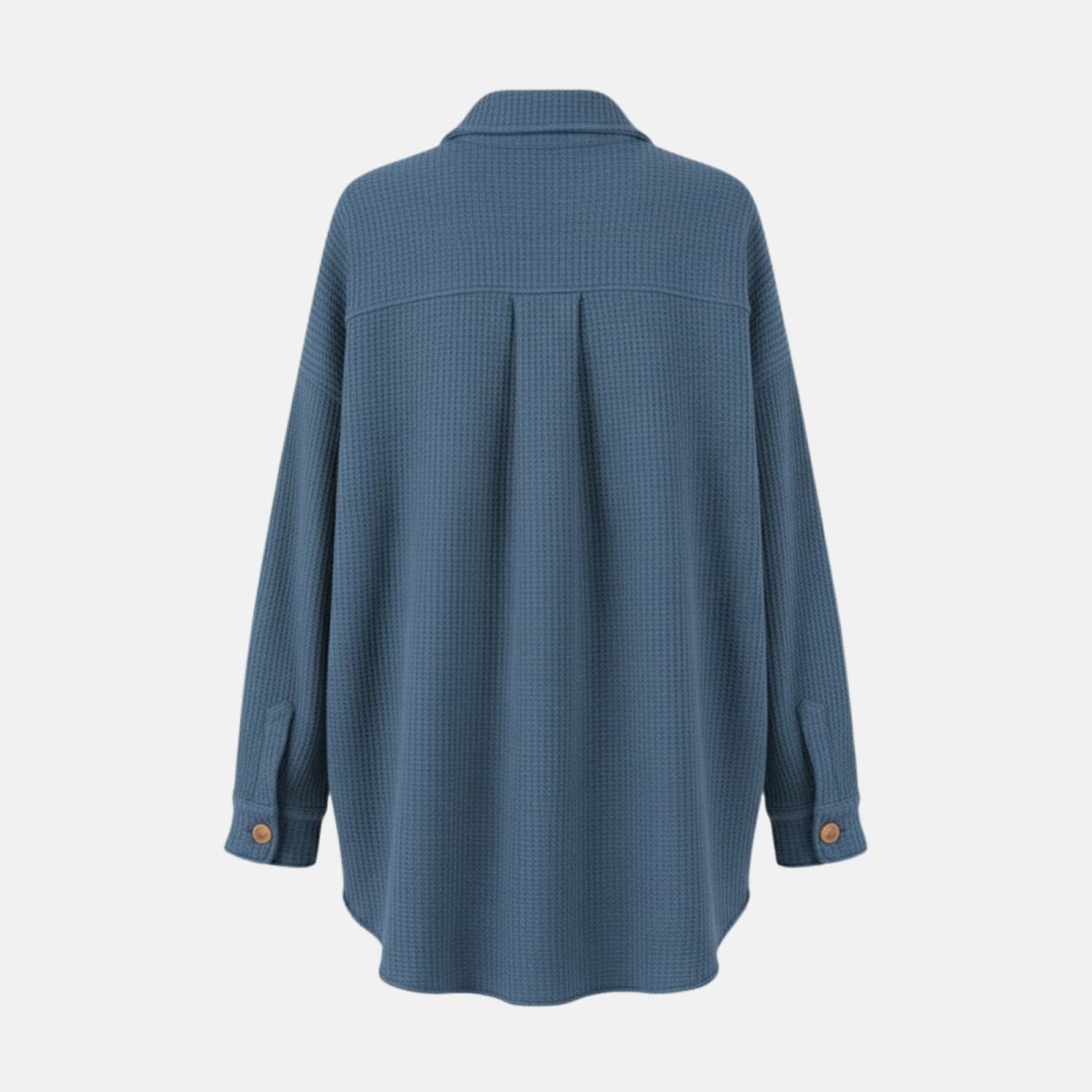 Flat lay of the back of the Kouvr slate blue donna knit shirt jacket showing the yoke and curved hem construction.