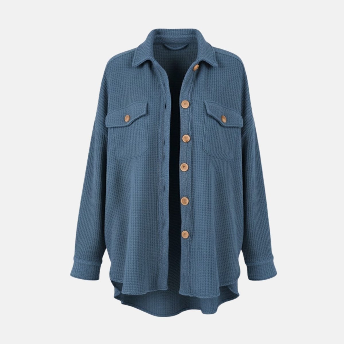 Flat lay of the front of the Kouvr slate blue shacket showing the waffle texture, chest pockets, and button details.