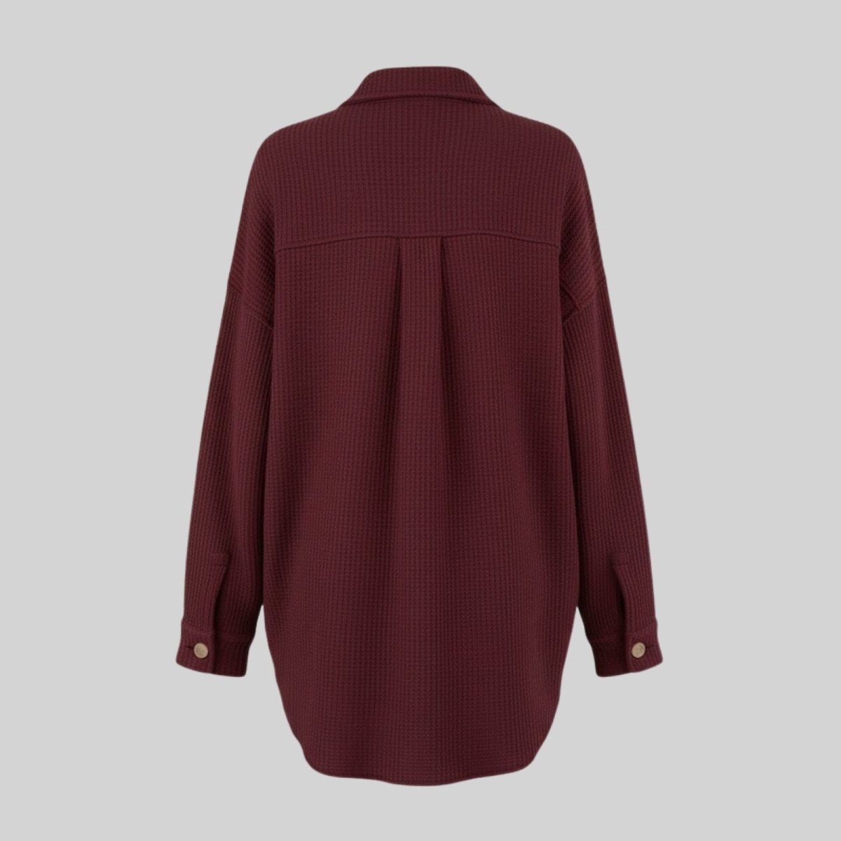 Flat lay of the back of the burgundy Donna shacket, detailing the textured waffle knit fabric and yoke design.