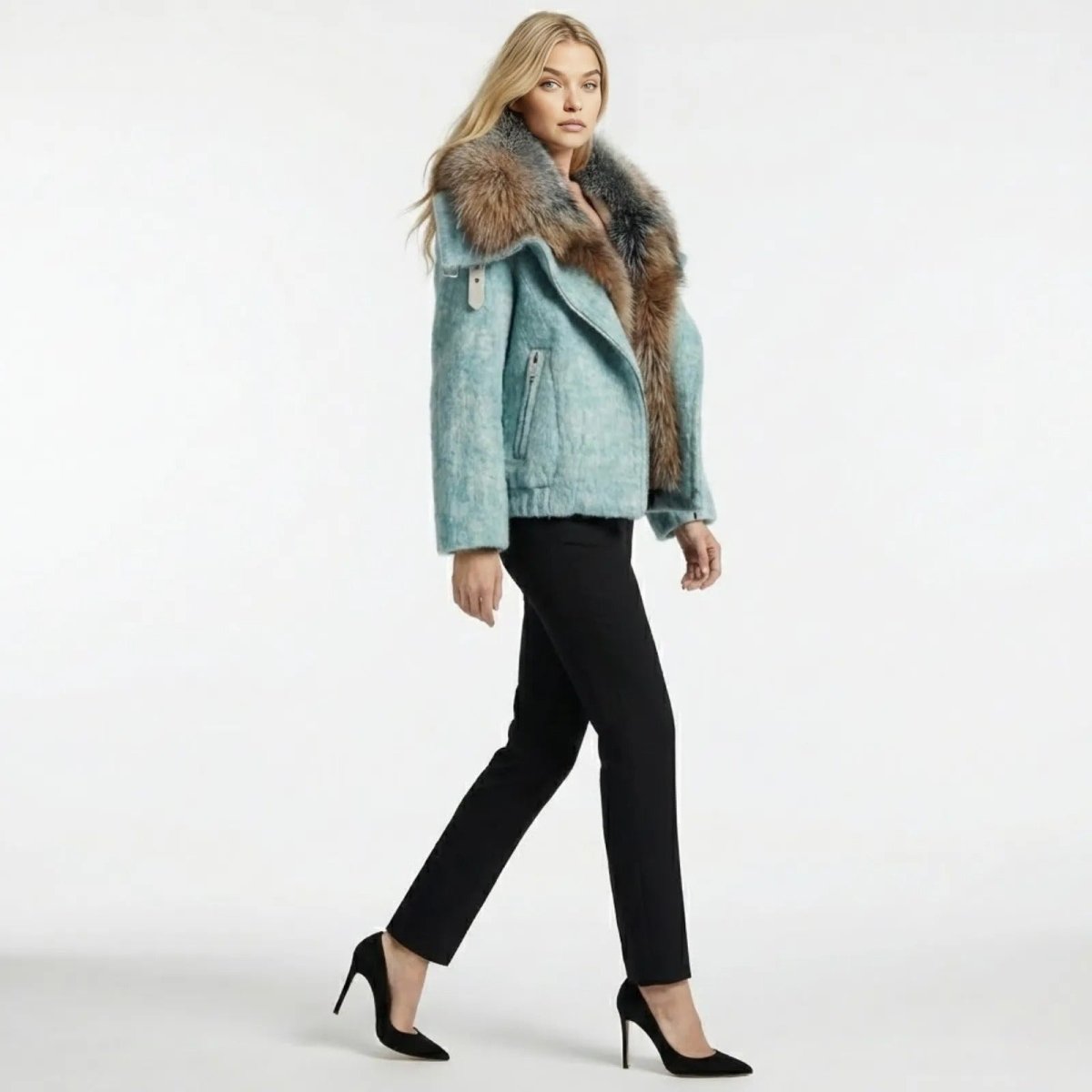 Side profile of a model walking in the Kouvr Dorothy light blue fur collar jacket, showing its relaxed silhouette and textured fabric.