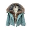 Product shot of the unzipped Kouvr Dorothy light blue wool jacket showing the plush fox fur collar and the white quilted puffer lining.
