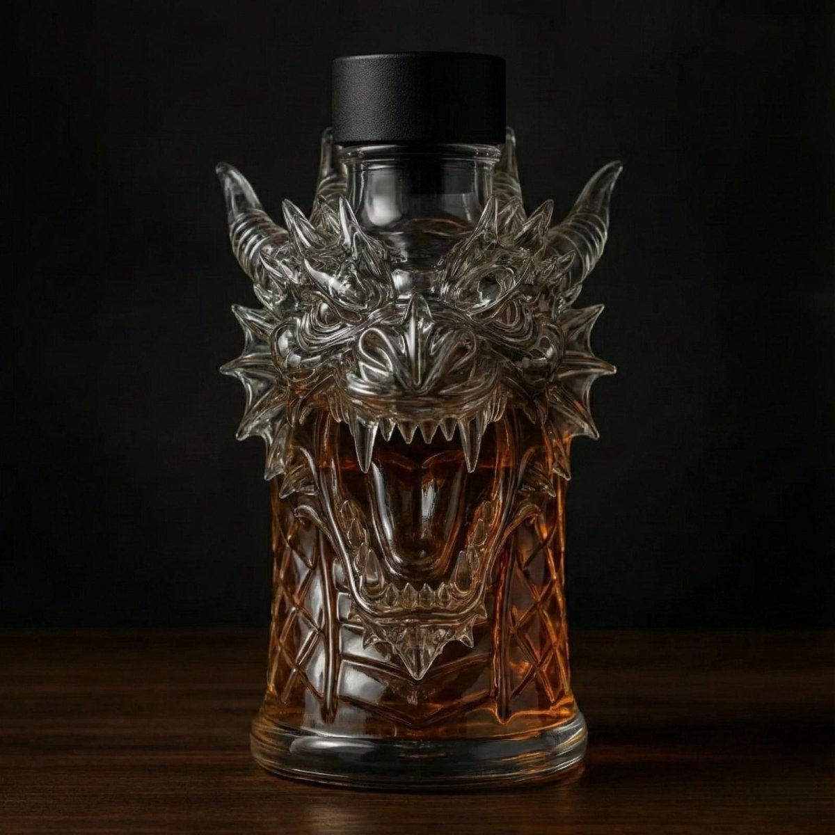 Front view of the Kouvr dragon head whiskey decanter, highlighting its sharp teeth and intricate facial details against a black background.