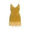 Model wearing the Kouvr Fashion Elena one-shoulder mini dress in shimmering gold metallic fringe