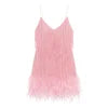 Model wearing Kouvr Elena pink feather fringe mini dress with sequin detail, holding a white bag