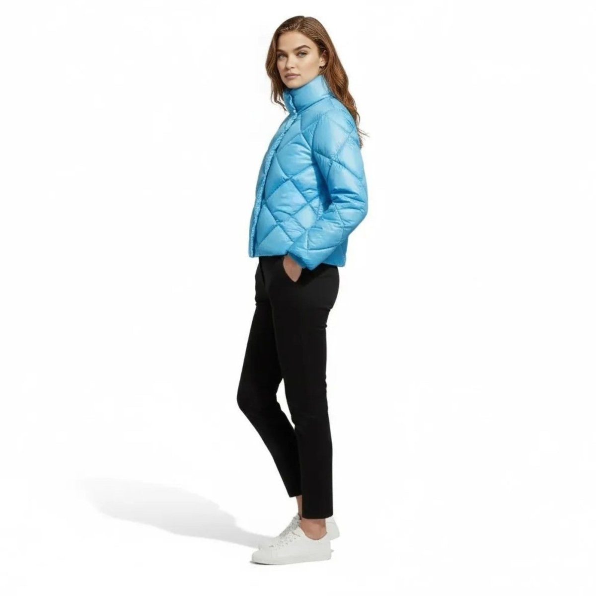 Model shown from the side wearing the Kouvr Elisse sky blue puffer jacket to display its silhouette and fit.