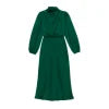 Model from the front wearing the Kouvr Ellana emerald long sleeve satin midi dress