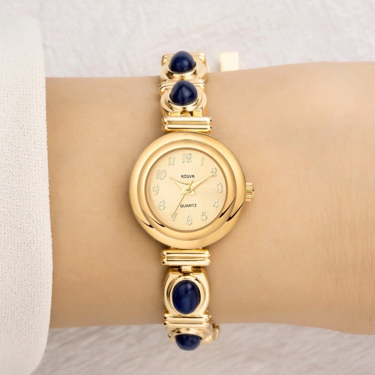 Close-up of the adjustable gold jewelry clasp on the Kouvr Elsinora bracelet watch.