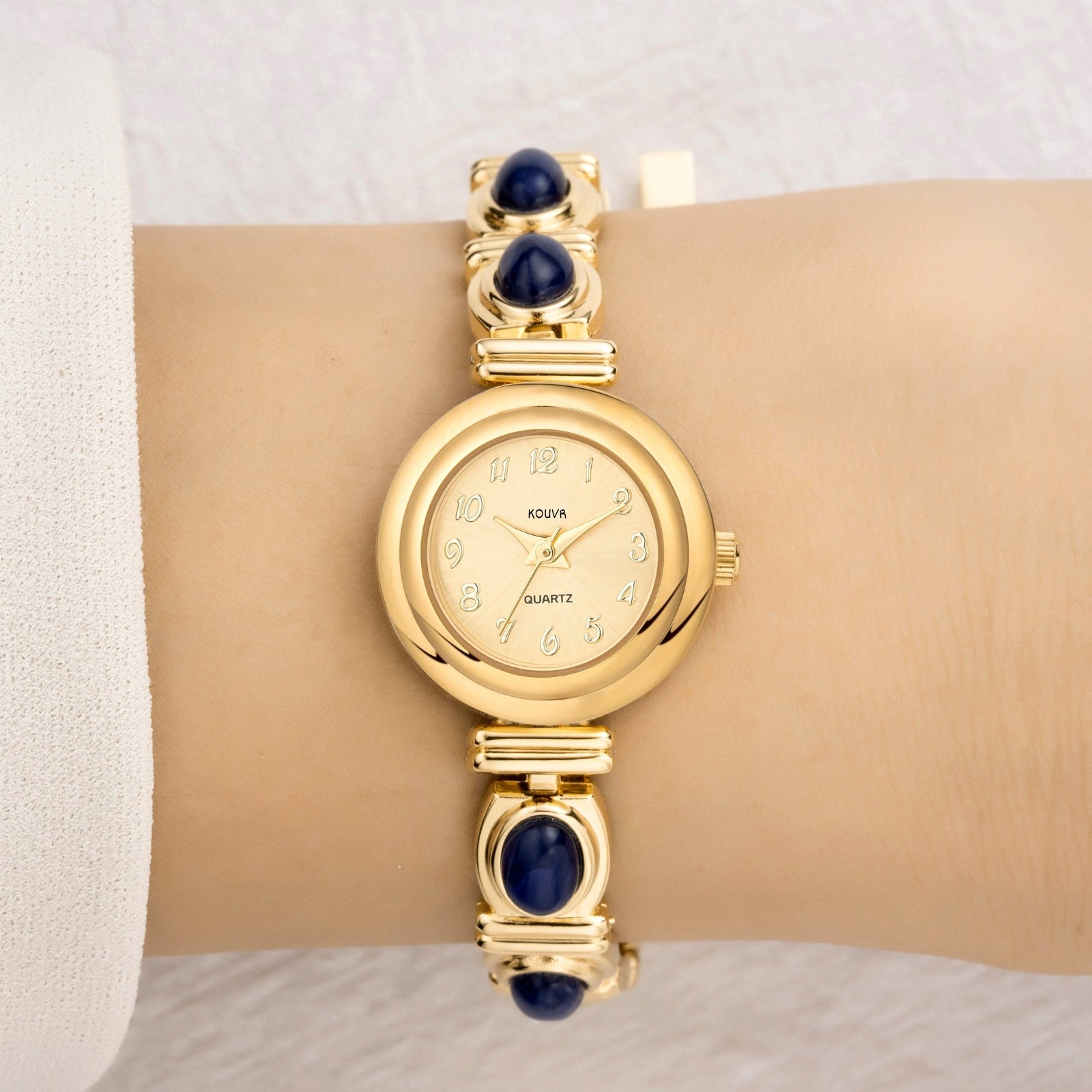 Close-up of the adjustable gold jewelry clasp on the Kouvr Elsinora bracelet watch.