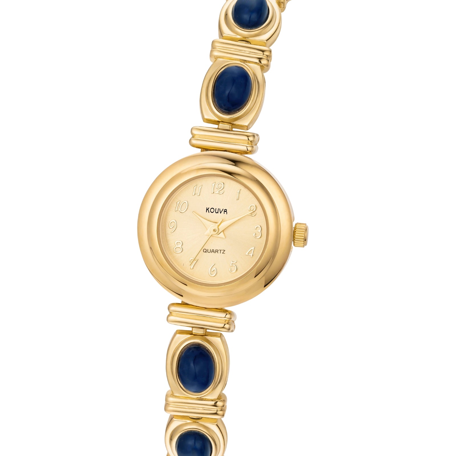 A woman's wrist wearing the Kouvr Elsinora elegant gold and blue stone bracelet watch with a white sleeve.