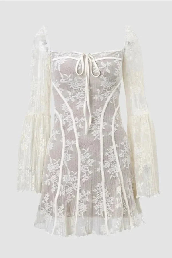 Model wearing the black Kouvr Elysia lace corset mini dress with long bell sleeves against a white background.