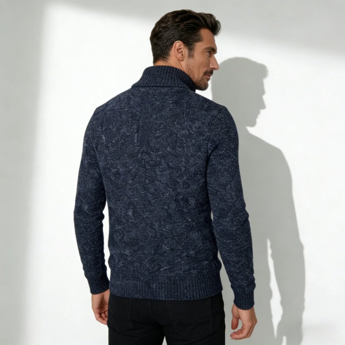 Back view of the Kouvr Elyson quarter-zip sweater in navy marl, highlighting the intricate textured knit pattern across the shoulders.
