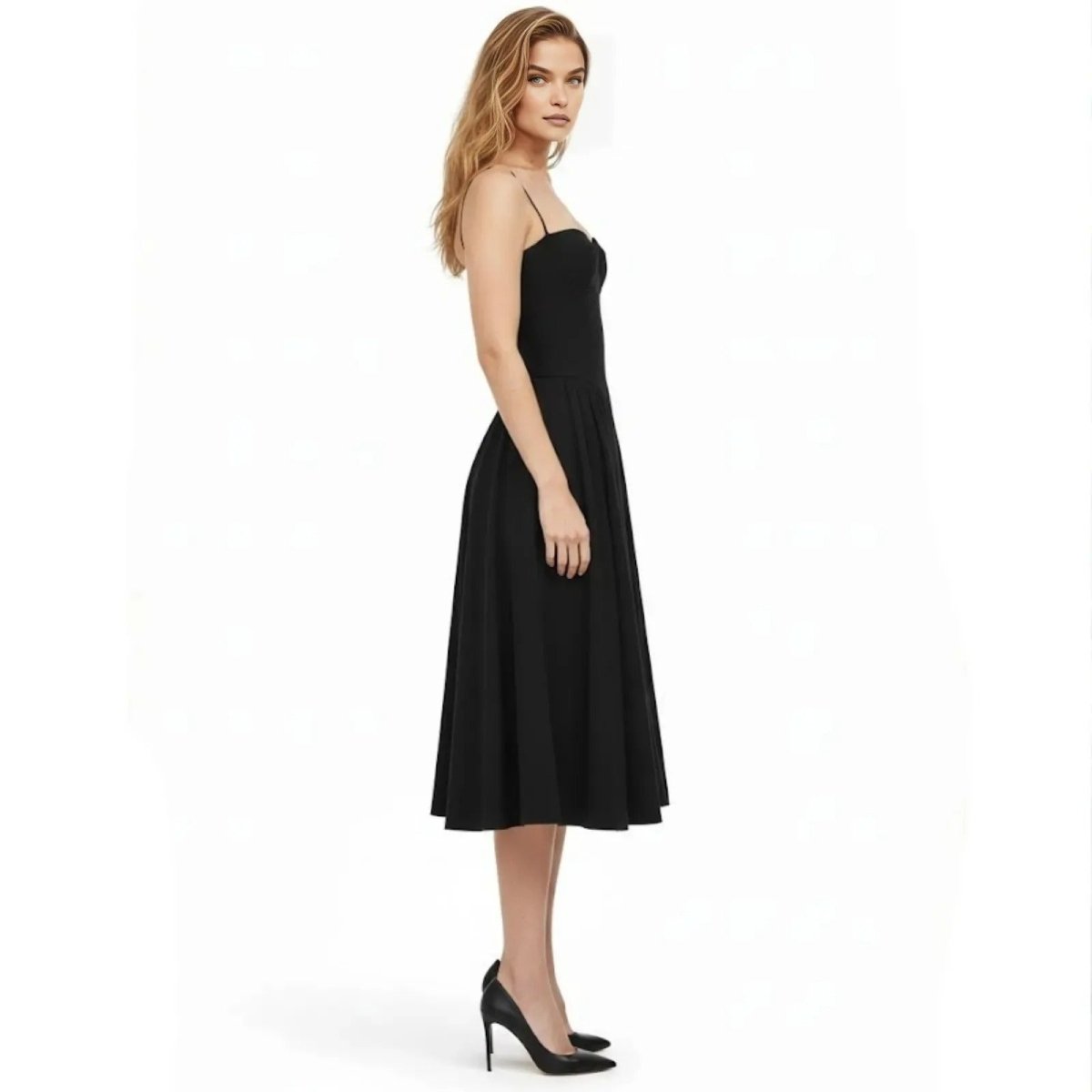 Side profile of a woman in the Kouvr Evdokia black formal dress, highlighting the cinched waist and elegant midi-length hem.