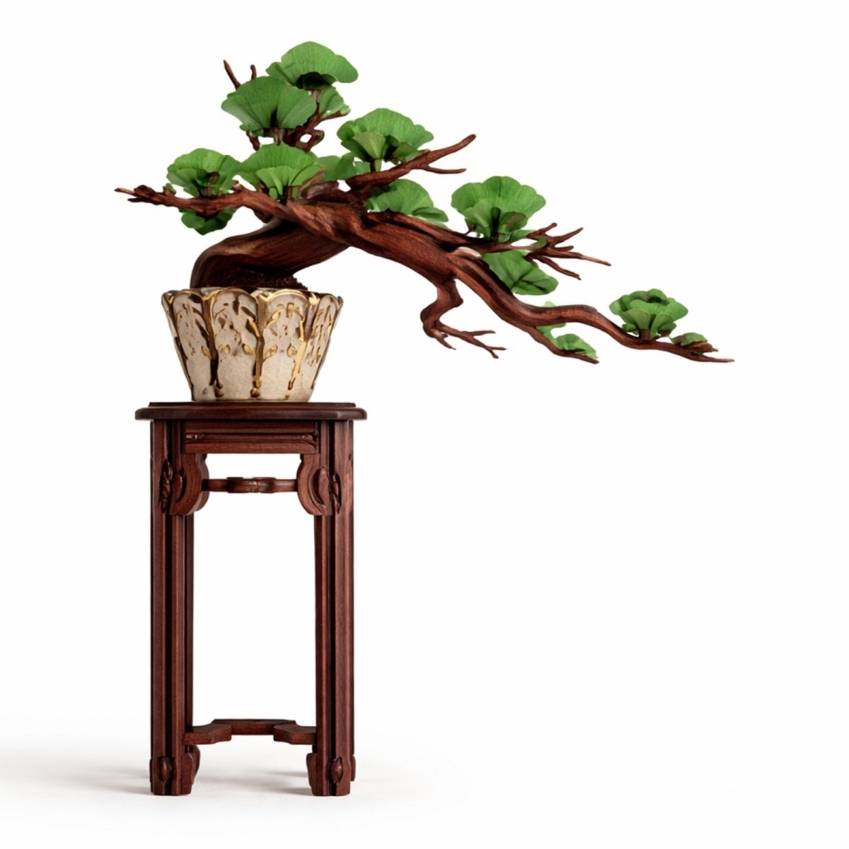 A completed Kouvr wooden evergreen pine bonsai tree model with green leaves and a gnarled brown trunk, sitting in a cream pot on a dark wood display stand against a white background.