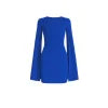 Woman wearing Kouvr Fashion's Eya blue mock neck bodycon dress with sheer cape sleeves