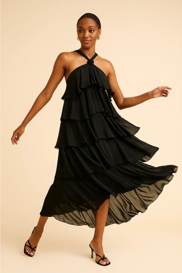 flowy," "cascading," "elegant silhouette," "floor-length," "sophisticated," and "minimalist formalwear