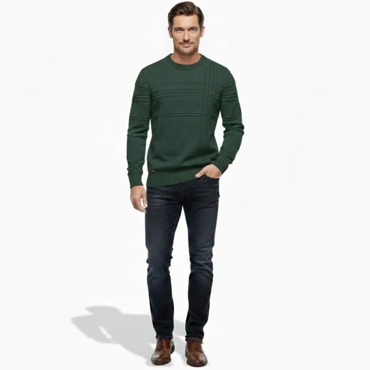 Male model wearing the Ander Textured Crewneck Sweater in forest green, paired with dark wash jeans and brown dress shoes, shown from the front.