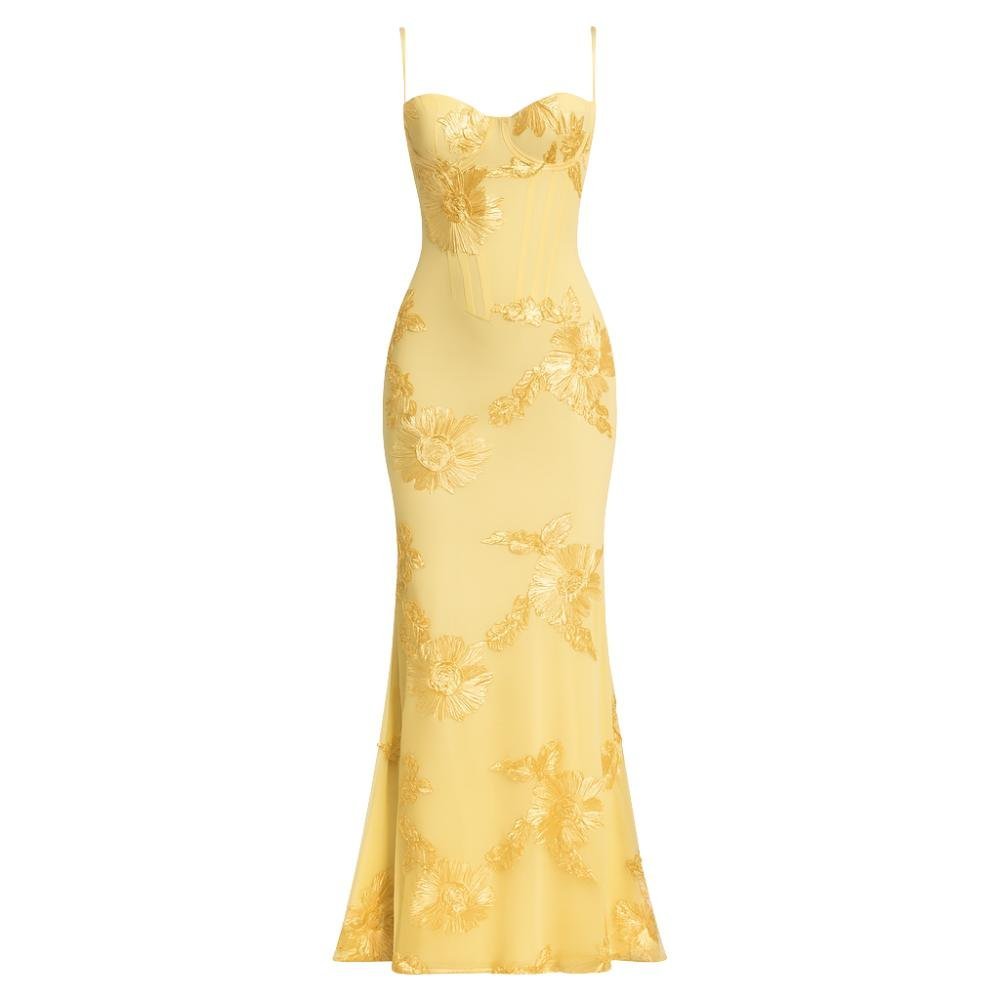 Yellow kouvr lace evening gown on a white background