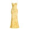 A model viewed from the back wearing the Kouvr Fashion Aphaea Gown, a backless yellow mermaid dress with 3D floral embroidery and an adjustable lace-up corset detail