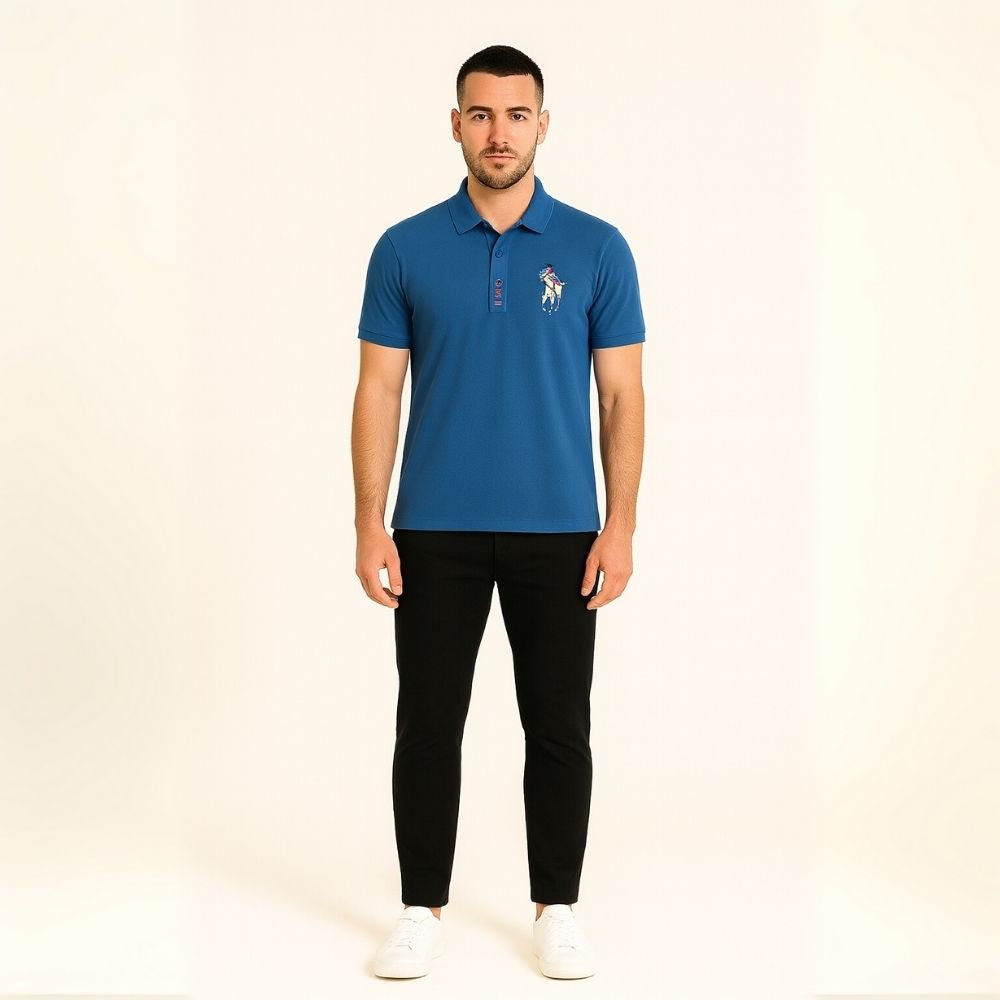 Model wearing the Kouvr Fashion Men's Slim Fit Piqué Polo in Azure Blue with black pants.