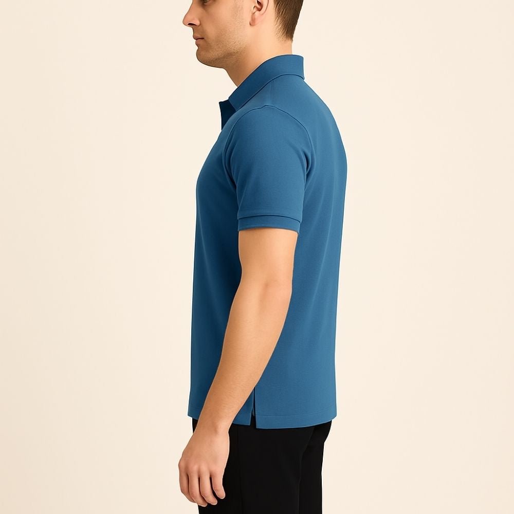 Model wearing the Kouvr Fashion Men's Slim Fit Piqué Polo in Azure Blue with black pants.