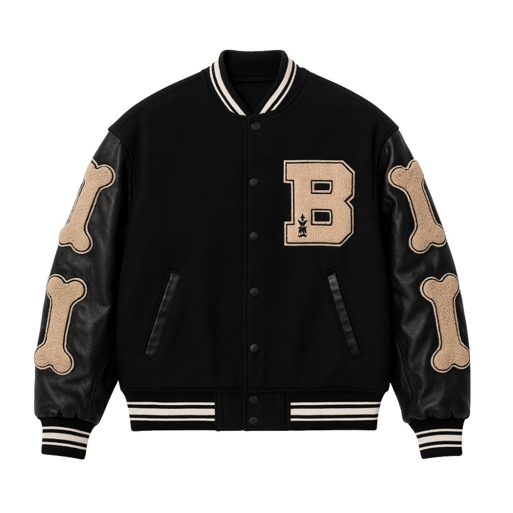Black Kouvr varsity jacket with beige 'B' and bone designs on a white background