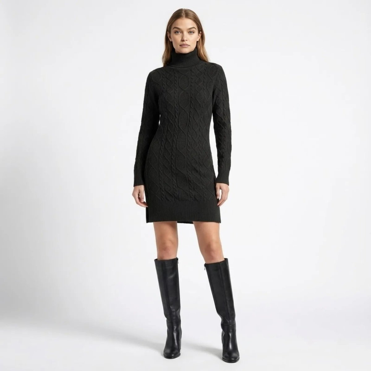 Model wearing the Kouvr Fashion black  cable-knit turtleneck sweater dress with long sleeves, styled with black knee-high boots against a white background.