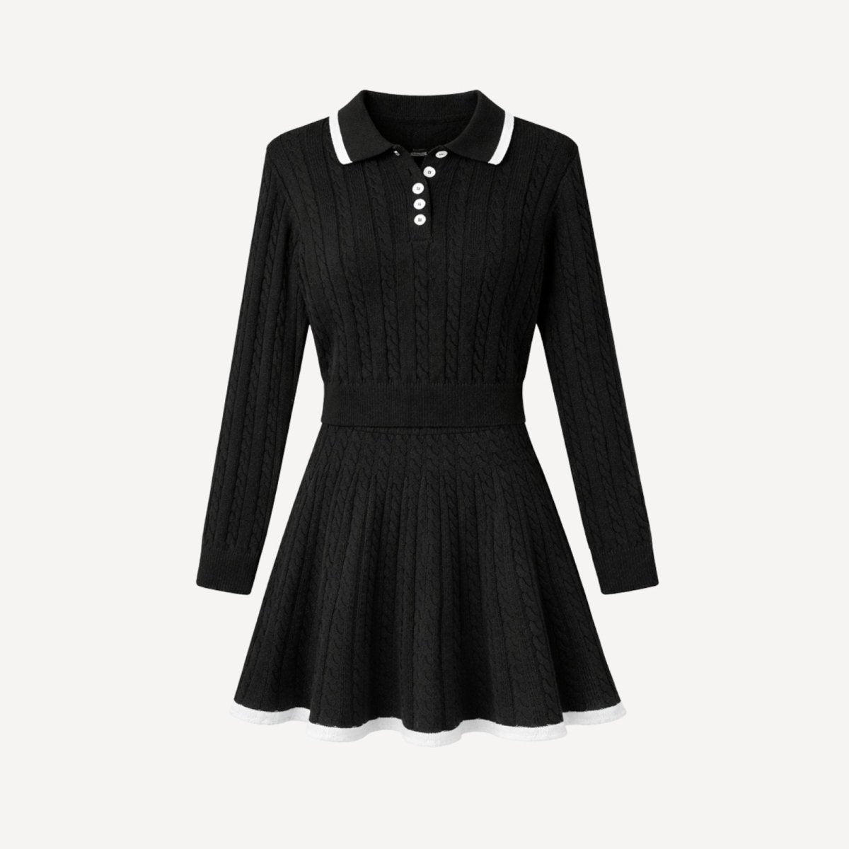 Flat lay of a long sleeve black polo sweater dress with pearl buttons, cable-knit texture, and white contrast tipping on the collar and hem.