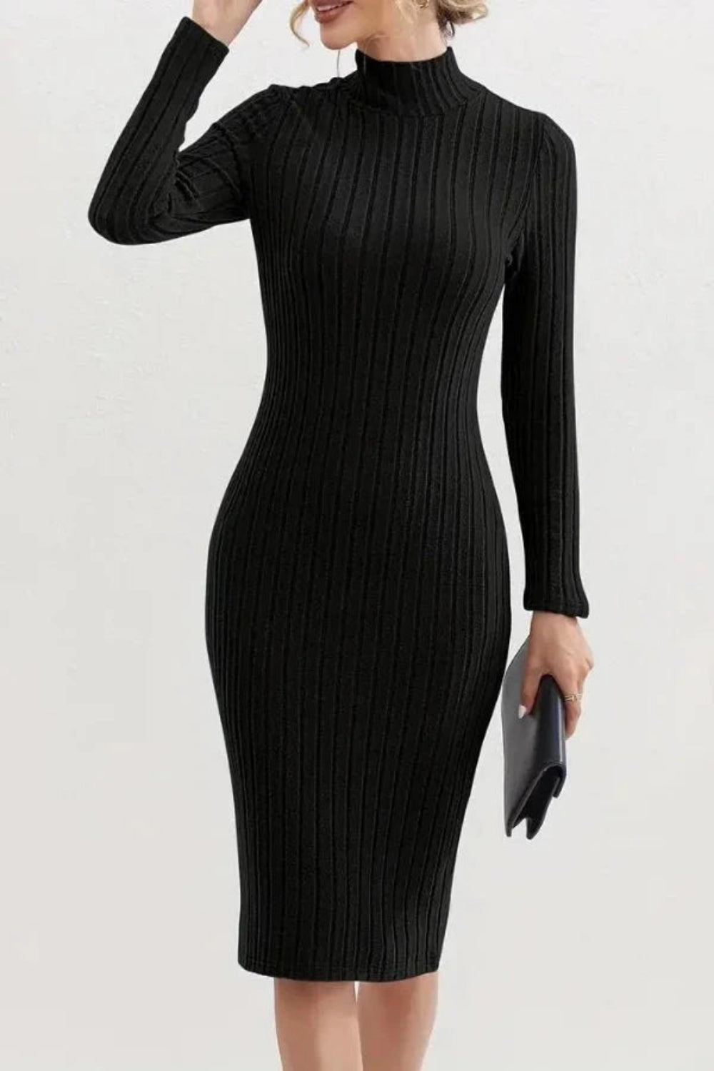 Model wearing the Kouvr Fashion long sleeve ribbed bodycon dress in black, holding a silver handbag