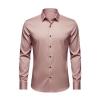 Flat lay of a men's luxury long sleeve dress shirt in pink, highlighting the spread collar and contrasting dark buttons.