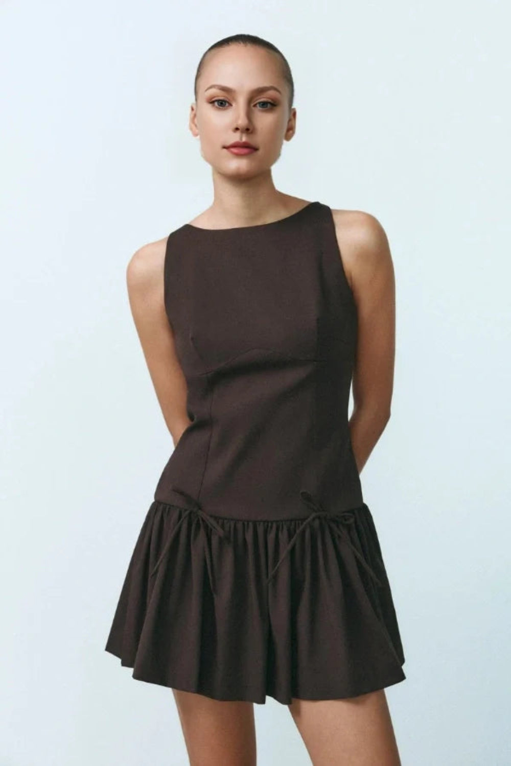 architectural silhouette', 'flared hem dress', 'quiet luxury aesthetic', 'minimalist party dress', 'boat neck dress', and 'day-to-night outfit