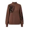 Product-only flatlay image of the Kouvr Fashion brown mock neck sweater, showing the full front design and floral embroidery on the chest and sleeve.