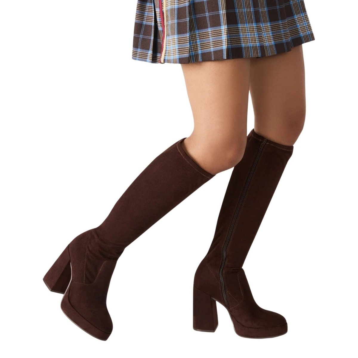 Brown Kouvr knee-high boots worn with a plaid skirt on a white background