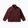 Flat lay product shot of the Kouvr Fashion burgundy sherpa fleece jacket, zipped up to show the front pockets and high-collar design.