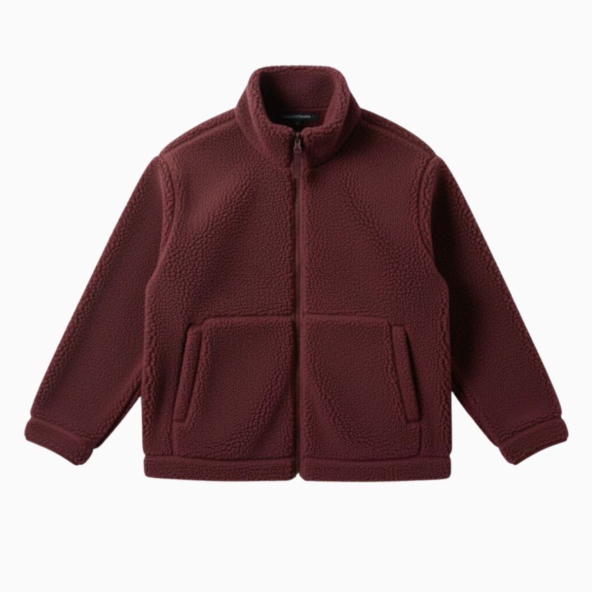Flat lay product shot of the Kouvr Fashion burgundy sherpa fleece jacket, zipped up to show the front pockets and high-collar design.