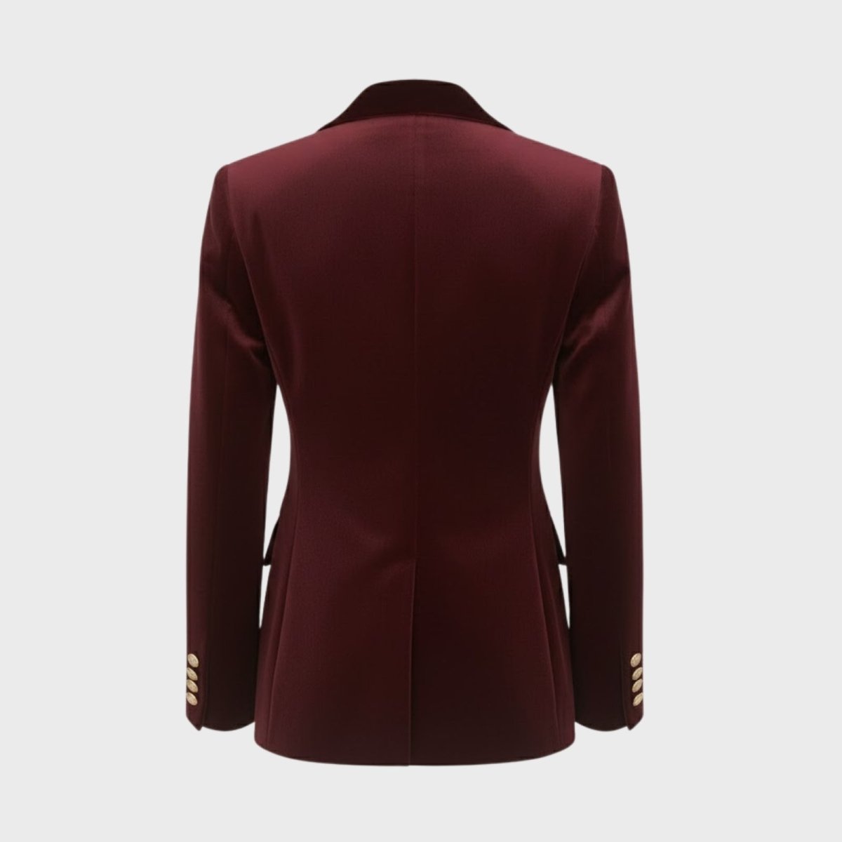 Flat lay back view of the Kouvr Fashion burgundy velvet blazer, detailing the tailored seams and gold button details on the cuffs.