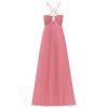 Model wearing the Kouvr Daphne Gown, a pink pleated halter maxi dress with waist cutouts, in a stone courtyard