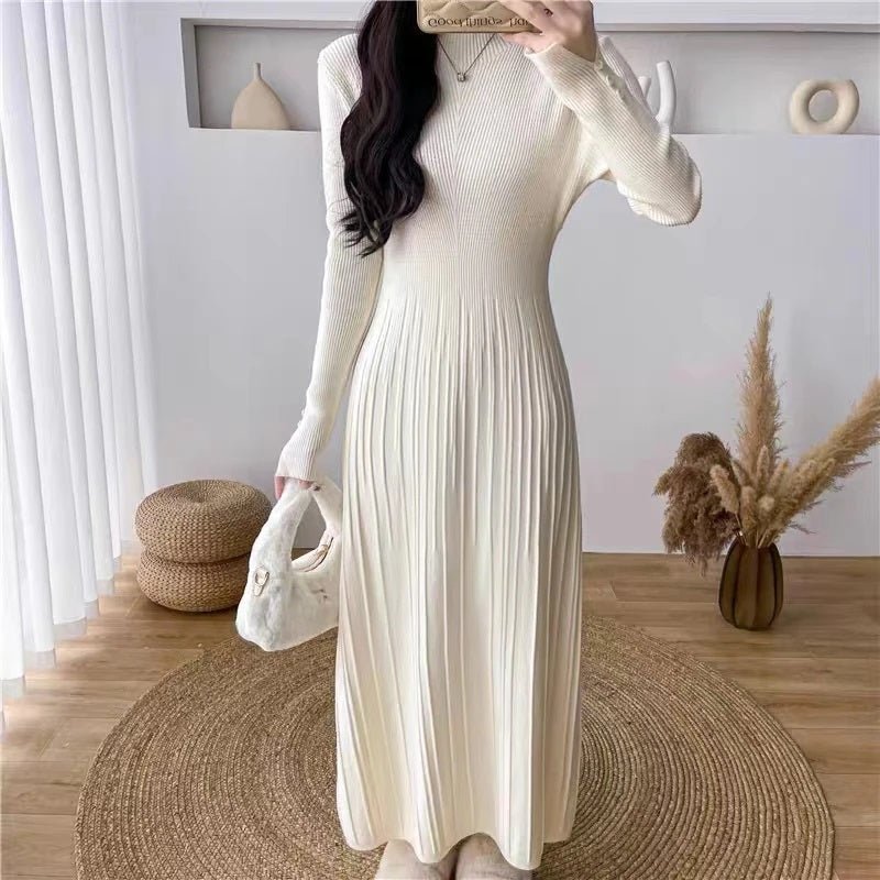 Close-up view of the ribbed knit texture and button cuff details on the ivory Dannah midi dress from Kouvr Fashion.