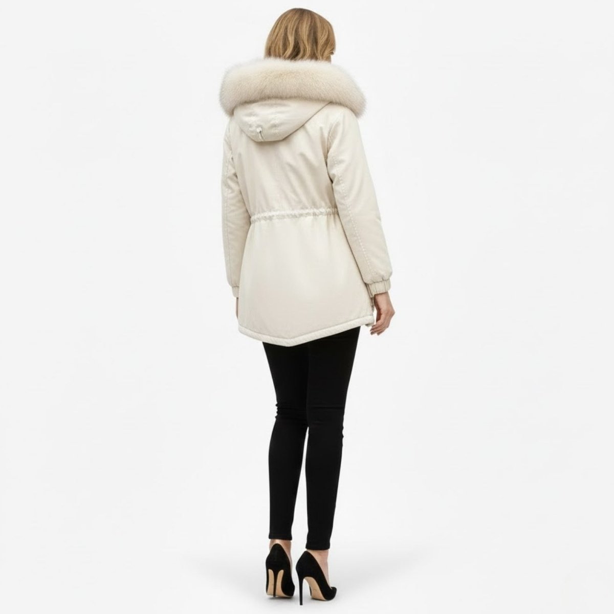 Back view of the cream Debra Luxe winter parka showing the full fox fur hood and adjustable waist drawstring detail.
