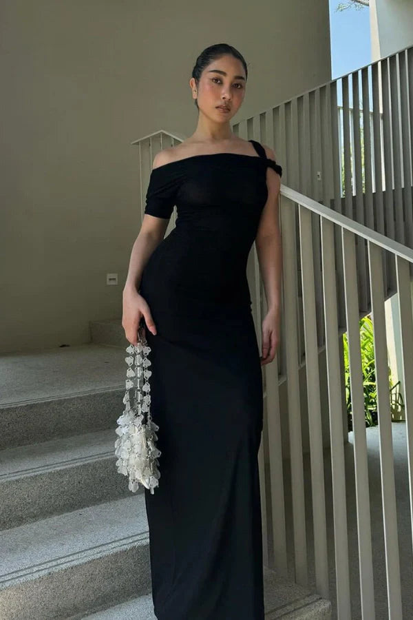 sculptural silhouette, draped jersey, architectural design, modern elegance, figure-flattering, minimalist formalwear, elevated essential.