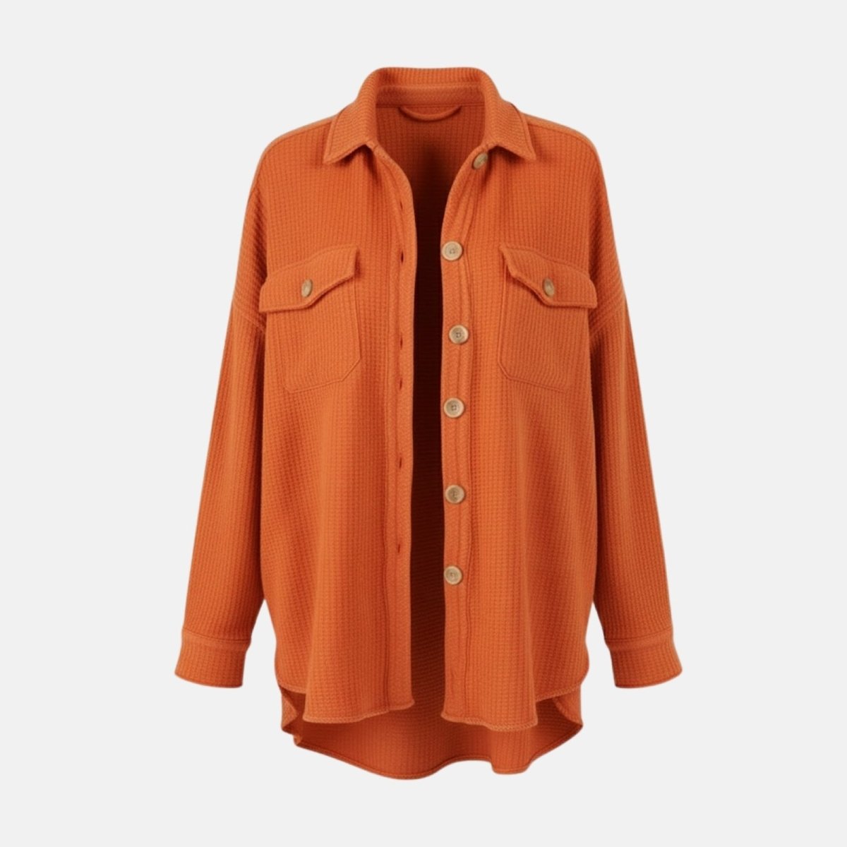 Flatlay of the burnt orange waffle knit shacket showing the front button placket, two chest pockets, and classic collar design.
