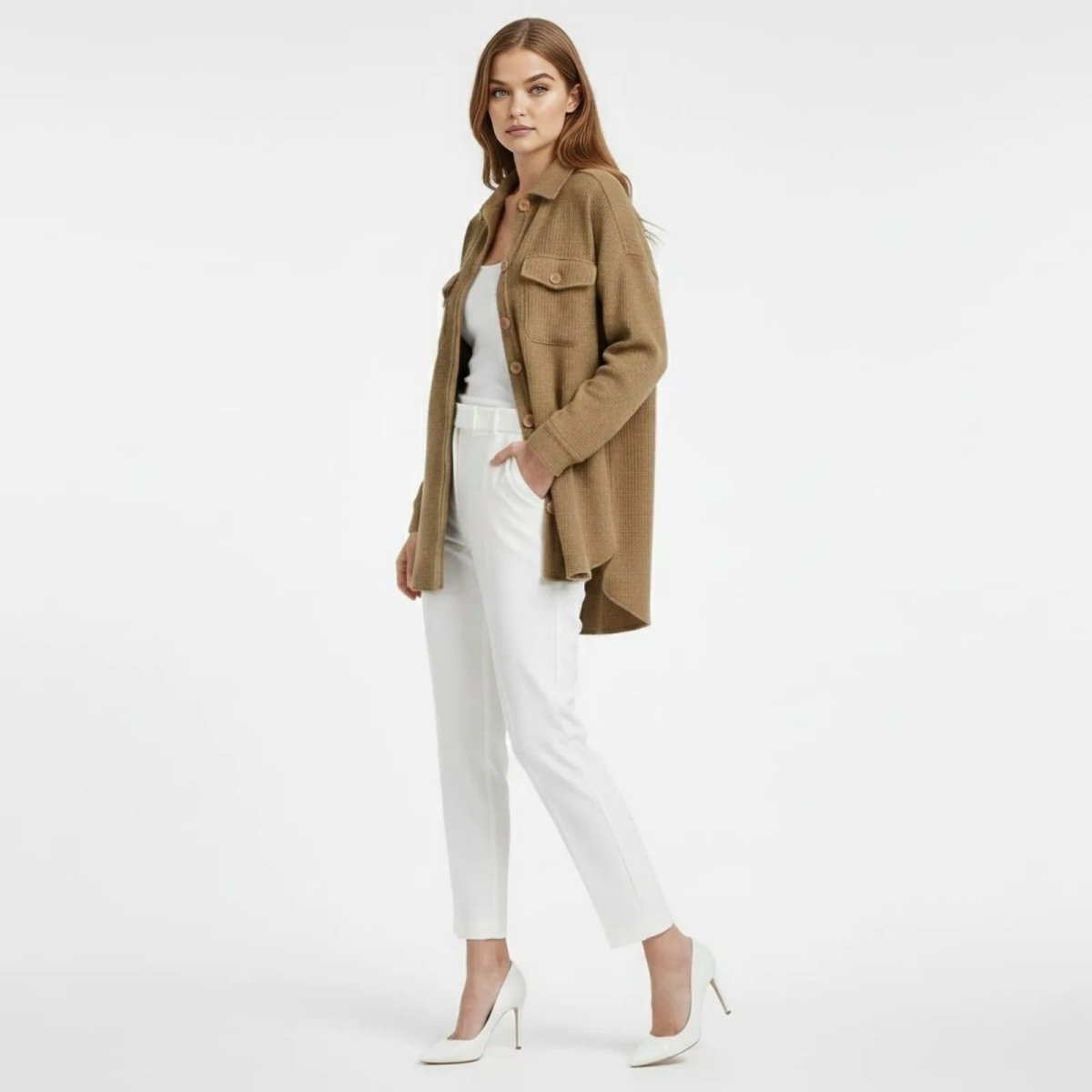 Side profile of a model wearing the long sleeve Donna Waffle Knit Shacket in khaki, showcasing its layering potential and oversized silhouette.