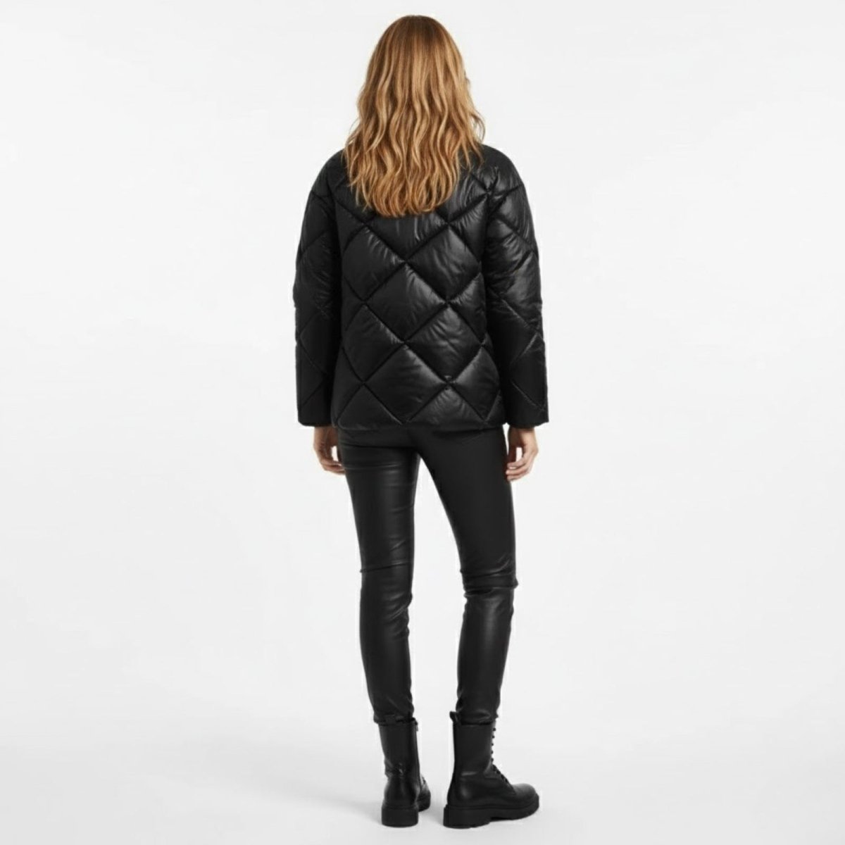 Back view of the Kouvr Fashion black puffer jacket showcasing the continuous diamond quilt pattern and relaxed silhouette.