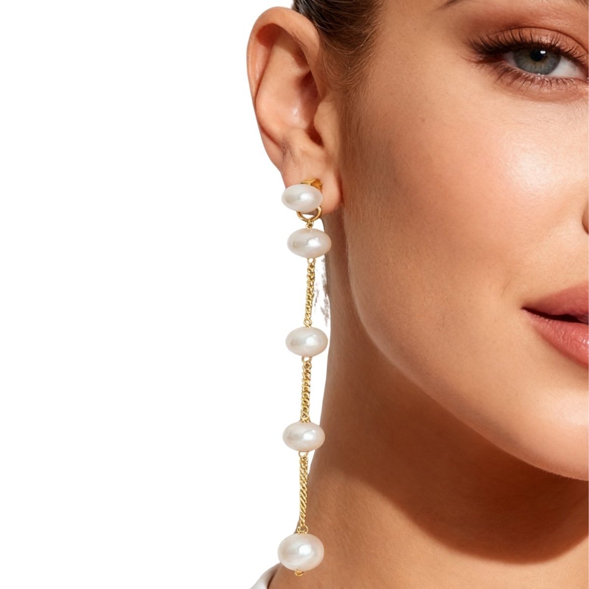 Pearl Kouvr earring worn by a model on a white background