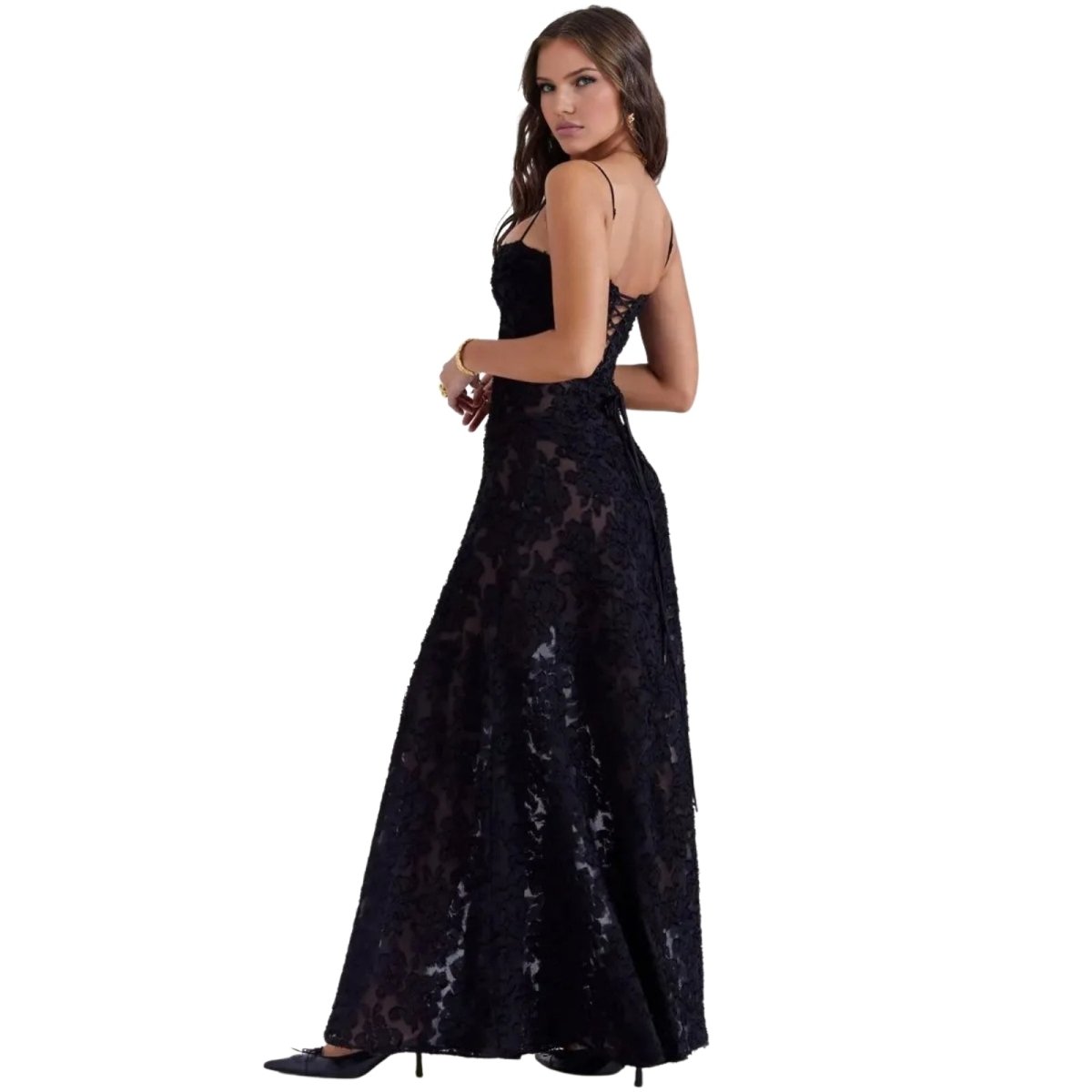 Woman wearing a black Kouvr lace evening gown on a white background