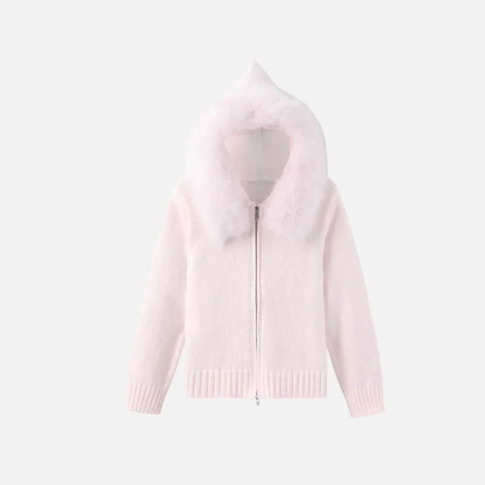 Woman wearing the Kouvr ivory knit hoodie with plush faux fur trim, styled with matching wide-leg pants