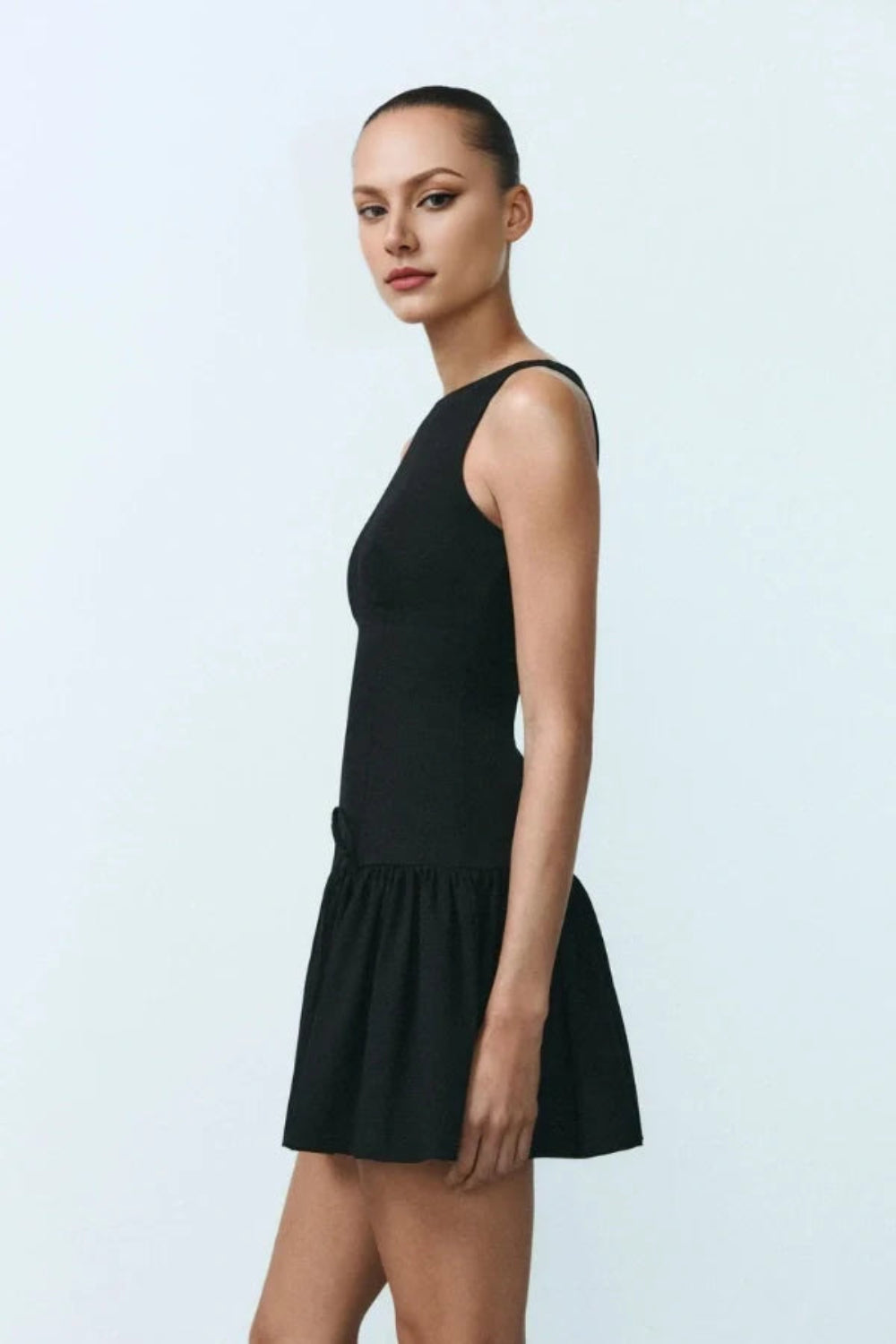 architectural dress', 'structured lbd', 'modern cocktail dress', 'ruffle hem mini dress', 'designer dress for women', 'day-to-night black dress', 'minimalist party dress