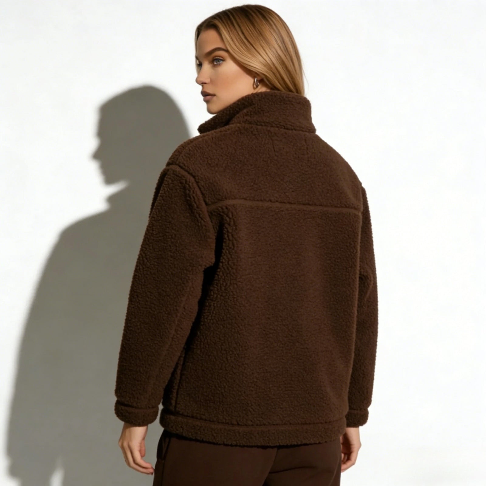 Back view of a model in the Kouvr Fashion Julie  Sherpa Fleece Jacket, highlighting the reinforced yoke seam and clean construction.