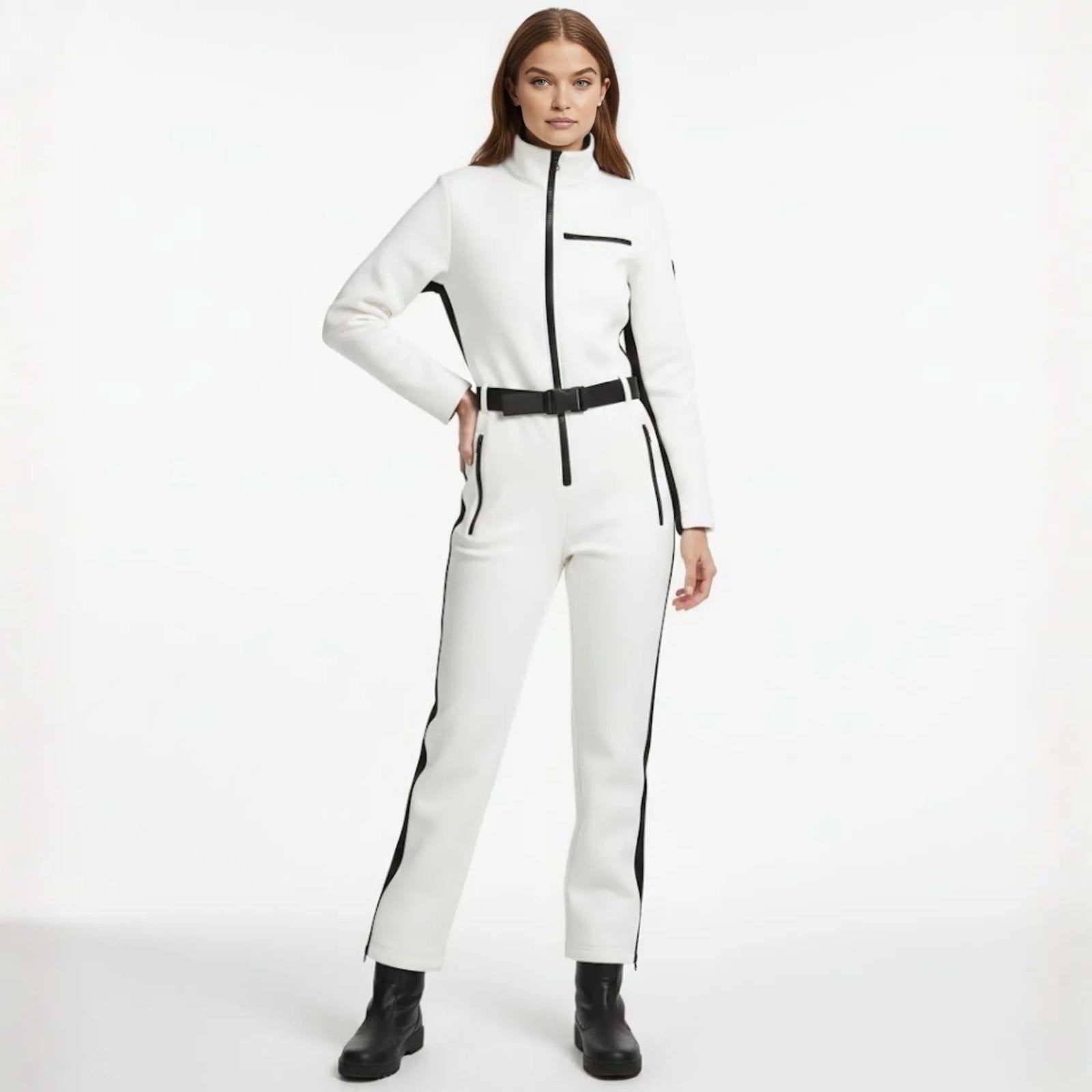 Model wearing the Kouvr Fashion Junnie white and black belted one-piece ski jumpsuit, facing forward.