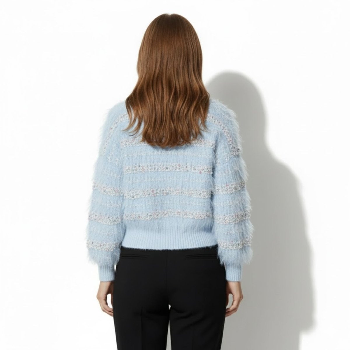 Back view of the Kyra blue cardigan by Kouvr Fashion, highlighting the sequin stripe pattern across the back and sleeves.