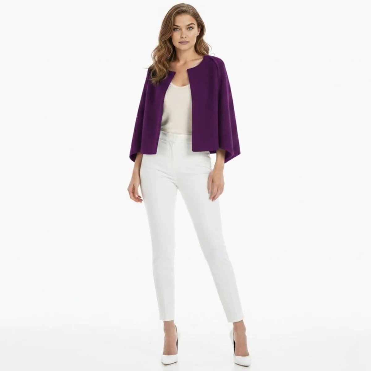 Model wearing the Kouvr Fashion Laverne purple structured cropped cape jacket, styled with a white camisole and white tailored trousers, showing the front view.